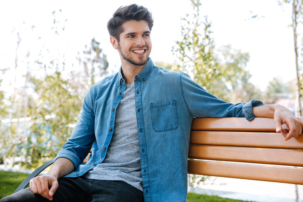 A man sitting on a bench - Teeth Whitening in Hillcrest